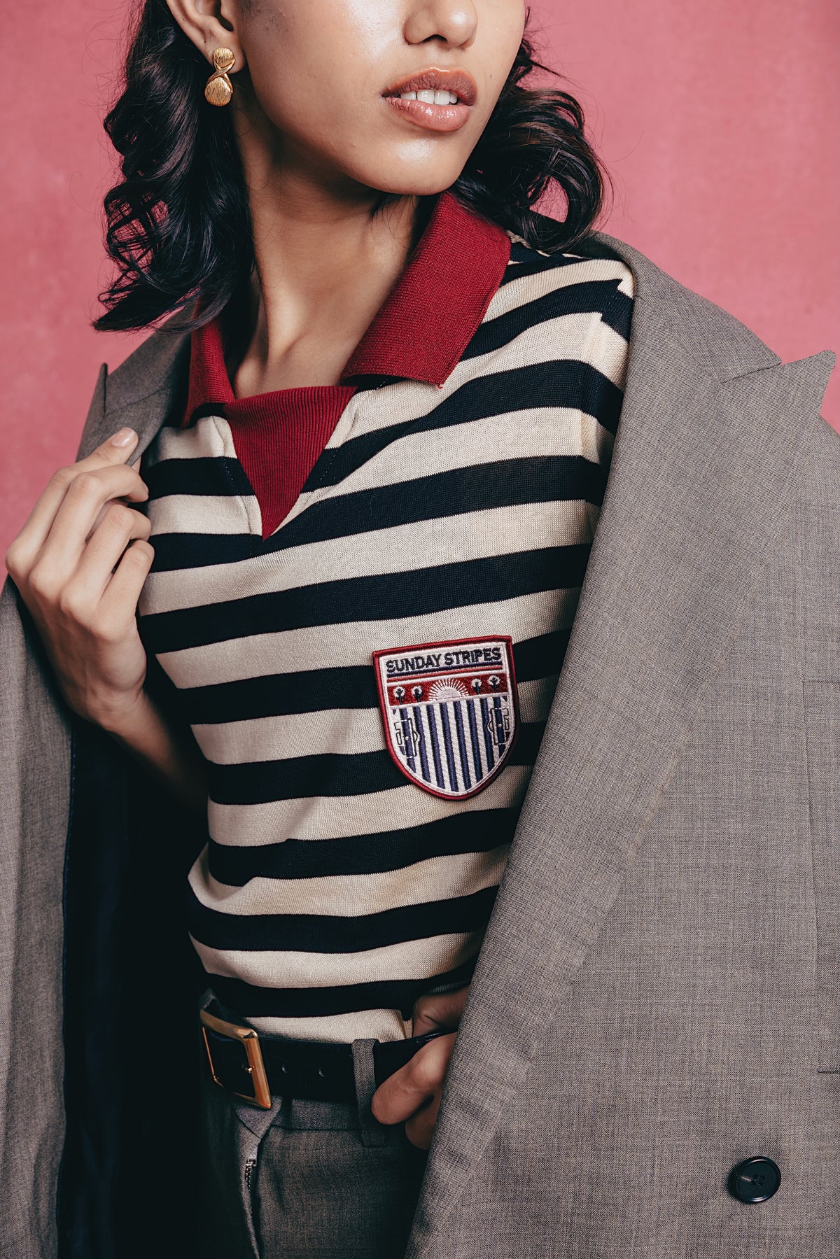 Girl wearing the Zebra striped polo shirts with a visible brand logo.