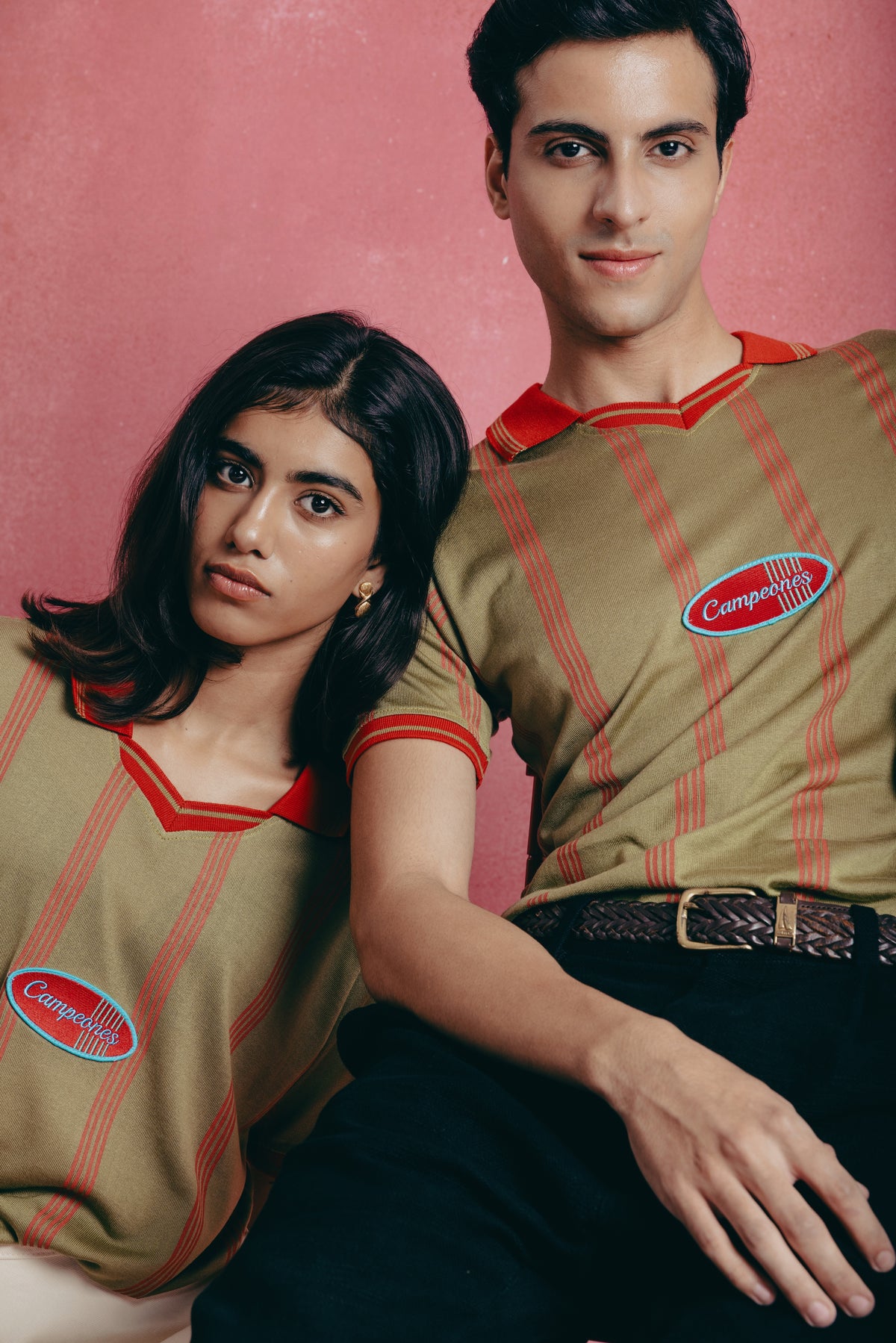 Two people wearing matching the Campeones a vintage-style shirts